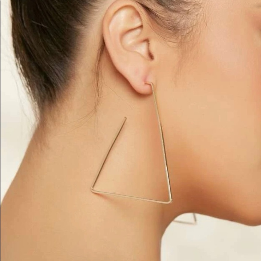Gold triangle earrings.